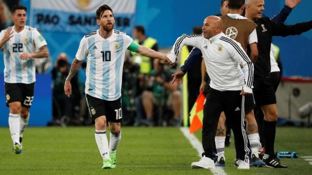 Argentina's Lionel Messi celebrates their second goal against Nigeria with coach Jorge Sampaoli at the FIFA World Cup 2018.(REUTERS)