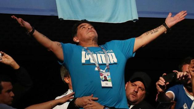 Fans take photos of Diego Maradona in the stands during Argentina’s FIFA World Cup 2018 game against Nigeria on Tuesday.(REUTERS)