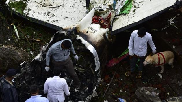 Firefighters inspect the site, where a small chartered plane crashed in Ghatkopar (West), Mumbai. Five people died when the plane hit a partially-constructed building. Two pilots, two engineers on board and a pedestrian died in the crash, said aviation regulator DGCA in a statement. The pilot and co-pilot have been identified as Captain P S Rajput and Marya Zuberi. (Vijayanand Gupta / HT Photo) Firefighters inspect the site, where a small chartered plane crashed in Ghatkopar (West), Mumbai. Five people died when the plane hit a partially-constructed building. Two pilots, two engineers on board and a pedestrian died in the crash, said aviation regulator DGCA in a statement. The pilot and co-pilot have been identified as Captain P S Rajput and Marya Zuberi. (Vijayanand Gupta / HT Photo)