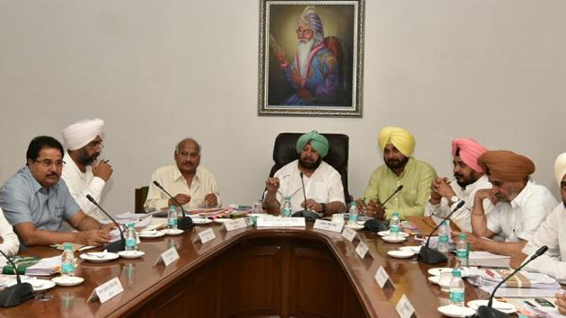 (From right) CM Capt Amarinder Singh and ministers Brahm Mohindra, Manpreet Singh Badal and OP Soni during the cabinet meeting in Chandigarh on Wednesday.(HT Photo)