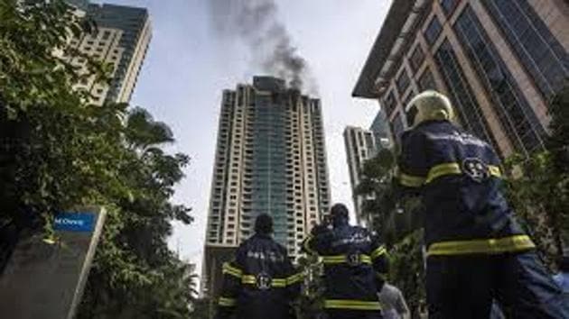 The fire engulfed the top three floors of the high-rise.