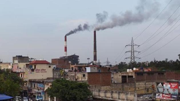 In this photograph taken on April 6, 2015, smoke billows from two smoke stacks at the coal-based Badarpur Thermal Station in New Delhi. (AFP File) In this photograph taken on April 6, 2015, smoke billows from two smoke stacks at the coal-based Badarpur Thermal Station in New Delhi. (AFP File)