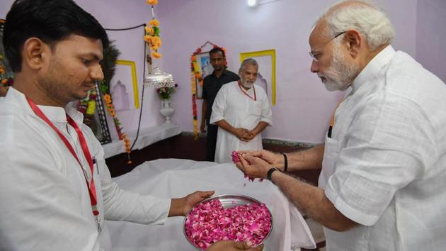 Prime Minister Narendra Modi offers a floral tribute at the samadhi of the great saint and poet, Kabir, at Maghar in Sant Kabir Nagar, Uttar Pradesh. “He rose from the dust but was honoured by everyone. He became an expression from a person and from a mere word turned into the speech of Brahma. He came as a thought and became immortal as a way of life,” Modi said about Kabir. (PIB / PTI) Prime Minister Narendra Modi offers a floral tribute at the samadhi of the great saint and poet, Kabir, at Maghar in Sant Kabir Nagar, Uttar Pradesh. “He rose from the dust but was honoured by everyone. He became an expression from a person and from a mere word turned into the speech of Brahma. He came as a thought and became immortal as a way of life,” Modi said about Kabir. (PIB / PTI)