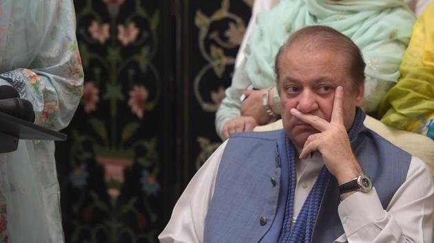 Ousted Pakistani prime minister Nawaz Sharif (R) has argued that the Pakistani military establishment, aided by top members of the judiciary, had orchestrated the lifetime ban on him returning to politics.(AFP FILE PHOTO)