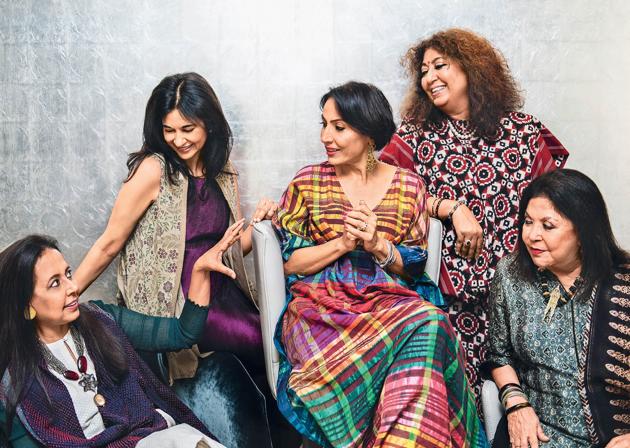 (From left) Anju Modi wears Banarasi cutwork palazzos, a chanderi kurta and bandhani cape, jewellery plus shoes (not seen in this picture) all from her own collection; Kavita Bhartia wears a crinkled garnet-hued silk dress with beige textured-hand block printed cape from her own collection and pearl earrings by Dior; Krishna Mehta wears a handwoven silk kaftan from her own brand, jewellery from Le Mill and shoes (not seen in this picture) by Stuart Weitzman; Madhu Jain wears an Uzbek bamboo silk Ikat choga, dupatta and loose pyjamas from her own brand and a South Sea pearl string; Ritu Kumar wears an ajrakh printed suit and skirt from her own brand and an antique mangalsutra from Coorg (Location courtesy: Roseate House, New Delhi; Art direction: Amit Malik; Assisted by: Ishaan Ishitava; Make-up and hair: Ambika Pillai Designer Salon)(Naina Redhu)