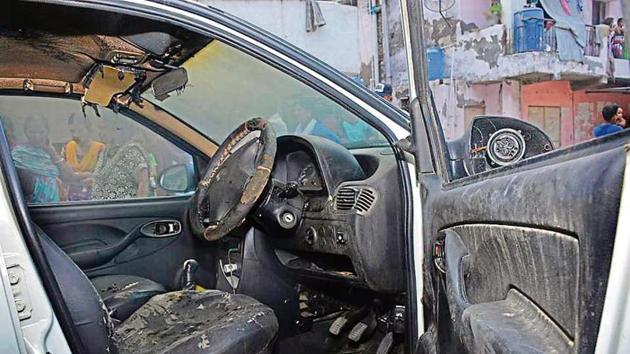 Photo of the cab in which 25-year-old cab driver Renu Chaudhury was found burnt, near Model Town underpass on the night of June 24. (HT Photo) Photo of the cab in which 25-year-old cab driver Renu Chaudhury was found burnt, near Model Town underpass on the night of June 24. (HT Photo)