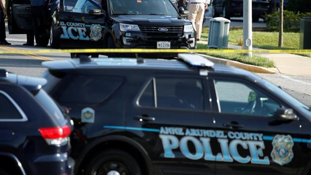 Police cars block the road in front of the Capital Gazette a day after a gunman opened fire at the newspaper's offices, killing five people and injuring several others in Annapolis, Maryland, US. (Reuters file photo) Police cars block the road in front of the Capital Gazette a day after a gunman opened fire at the newspaper's offices, killing five people and injuring several others in Annapolis, Maryland, US. (Reuters file photo)