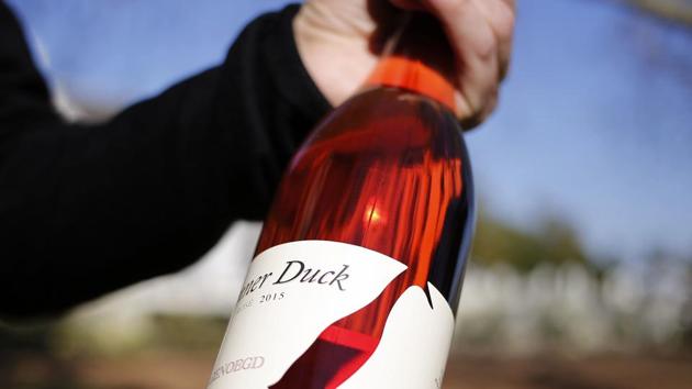 A bottle of Runner Duck wine, produced on the Vergenoegd wine estate. When Pinot Noir pioneers arrived in Oregon from California in the 1960s, they had to contend with shorter growing seasons, more frost, winter freezes and more rain during harvest time, Jones said. They adjusted farming techniques, and the climate became milder. Now, “we’re in the sweet spot,” he said. But this won’t be for long if weather trends continue. (Schalk van Zuydam / AP File) A bottle of Runner Duck wine, produced on the Vergenoegd wine estate. When Pinot Noir pioneers arrived in Oregon from California in the 1960s, they had to contend with shorter growing seasons, more frost, winter freezes and more rain during harvest time, Jones said. They adjusted farming techniques, and the climate became milder. Now, “we’re in the sweet spot,” he said. But this won’t be for long if weather trends continue. (Schalk van Zuydam / AP File)
