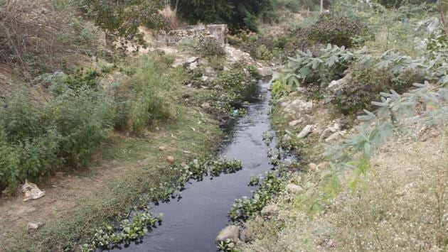 Construction work has reduced the size of Gurugram’s Ghata jeel and supporting waterways, putting strain on the environment and increasing risk of flooding.(Yogendra Kumar/HT PHOTO) Construction work has reduced the size of Gurugram’s Ghata jeel and supporting waterways, putting strain on the environment and increasing risk of flooding.(Yogendra Kumar/HT PHOTO)