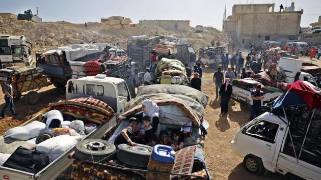 People gathered in minivans and tractors in the morning, loading them with mattresses, water tanks and furniture. Lama Fakih, deputy director of the Middle East region for Human Rights Watch, said Syrians are often driven to leave by “oppressive” living conditions in Lebanon, including a lack of residency rights, restrictions on their movement and inability to enrol children in school. (Bilal Hussein / AP)
