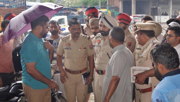 Police Commissioner Sukhchain Singh Gill along with police officers visits the new grain market where Gurjeet Chaudhary was shot dead in Ludhiana on Thursday, June 28.(HT Photo)