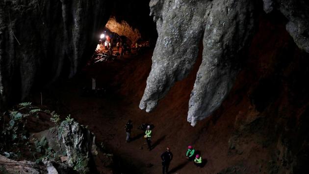 Rescue workers are seen in Tham Luang caves during a search for 12 members of an under-16 soccer team and their coach, in the northern province of Chiang Rai, Thailand. (Soe Zeya Tun / REUTERS) 
