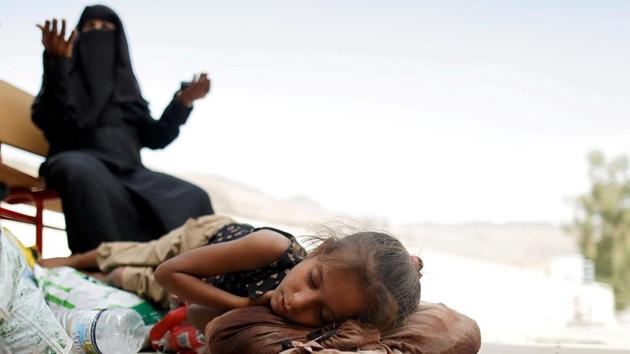 A woman displaced by the fighting in the Red Sea port city of Hodeidah reacts as she waits to be registered at an IDP registration center in Sanaa, Yemen. (Khaled Abdullah / REUTERS) 