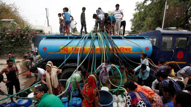 Summer temperatures in Delhi can soar as high as 45 degrees Celsius and areas outside the main government districts suffer badly, when taps run dry and groundwater levels fall. Both Delhi and Bengaluru, India’s software capital, will run out of groundwater by 2020, the report said. (Adnan Abidi / REUTERS)