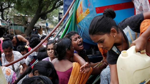 Fights frequently break out when government-run water tankers arrive and people, mostly women and children, converge with their cans and buckets. In one such incident in Wazirpur in northwest Delhi, Lal Bahadur, 60, died after a brawl with neighbours over water in March. His 18-year-old son, Rahul, who also suffered serious injuries, died in hospital a month later. (Adnan Abidi / REUTERS)