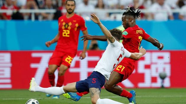 Belgium's Michy Batshuayi shoots at goal as England's John Stones challenges. (REUTERS)