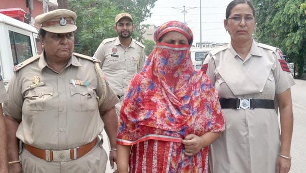 Accused Manjit Kaur in police custody in Amritsar on Saturday. (HT Photo) Accused Manjit Kaur in police custody in Amritsar on Saturday. (HT Photo)