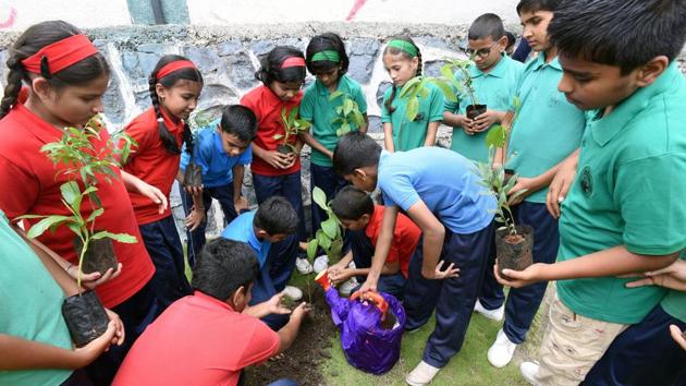 Each class of the Jaywant Public School planted a tree on Friday and will be responsible, as a class, to care for the sapling until it reaches full maturity.(Pratham Gokhale/HT Photo) Each class of the Jaywant Public School planted a tree on Friday and will be responsible, as a class, to care for the sapling until it reaches full maturity.(Pratham Gokhale/HT Photo)