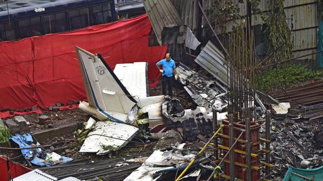 AAIB officials examine the crash site where a chartered plane crashed into an under-construction site on Thursday.(Vijayanand Gupta/HT Photo) AAIB officials examine the crash site where a chartered plane crashed into an under-construction site on Thursday.(Vijayanand Gupta/HT Photo)