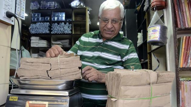A shopkeeper replaces plastic bag with paper bags in Pune on Friday. (Ravindra Joshi/HT PHOTO) A shopkeeper replaces plastic bag with paper bags in Pune on Friday. (Ravindra Joshi/HT PHOTO)