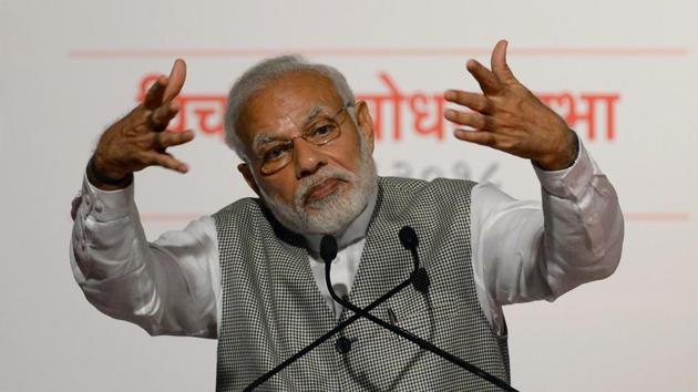 Prime Minister Narendra Modi gestures as he addresses Bharatiya Janata Party (BJP) supporters on the occasion of the 43rd anniversary of the imposition of "the Emergency" period in Mumbai on June 26, 2018. (Punit Paranjpe / AFP) Prime Minister Narendra Modi gestures as he addresses Bharatiya Janata Party (BJP) supporters on the occasion of the 43rd anniversary of the imposition of "the Emergency" period in Mumbai on June 26, 2018. (Punit Paranjpe / AFP)