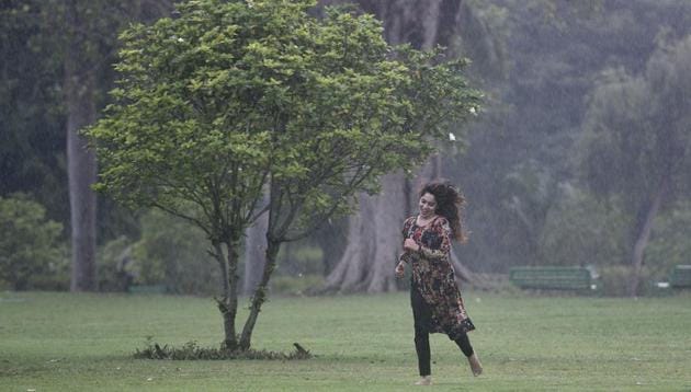 A girl enjoys in the rain at Lodhi Gardens in New Delhi, India, on Friday, June 29, 2018. (Sanchit Khanna/HT PHOTO) A girl enjoys in the rain at Lodhi Gardens in New Delhi, India, on Friday, June 29, 2018. (Sanchit Khanna/HT PHOTO)