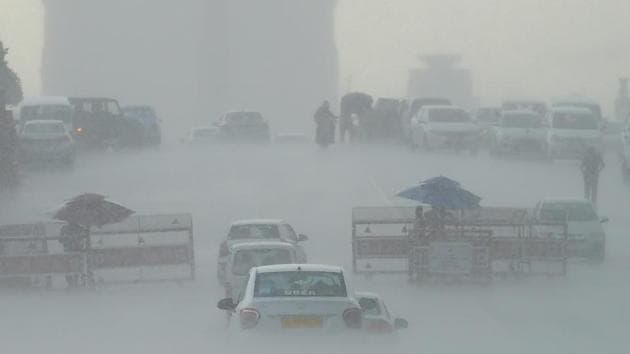 Traffic move during rainfall at Vijay Chowk in New Delhi on June 28, 2018. (Vijay Verma / PTI) Traffic move during rainfall at Vijay Chowk in New Delhi on June 28, 2018. (Vijay Verma / PTI)