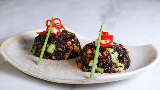 Organic aromatic Himalayan black rice tossed with vegetables and cottage cheese in Chinese style.