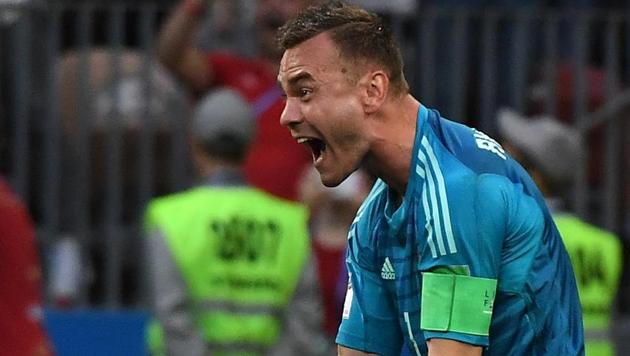 Igor Akinfeev celebrates after Russia defeated Spain in the penalty shootout of a FIFA World Cup Rd of 16 match.(Utpaal Sorkkar)