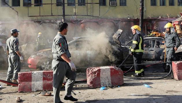 Afghan policemen inspect the site of a blast in Jalalabad city, Afghanistan on July 1.(REUTERS) Afghan policemen inspect the site of a blast in Jalalabad city, Afghanistan on July 1.(REUTERS)