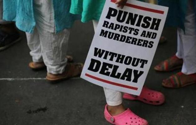 In this April 15, 2018 file photo, an Indian protestor stands with a placard during a protest against two recently reported rape cases as they gather near the parliament in New Delhi, India. (AP) In this April 15, 2018 file photo, an Indian protestor stands with a placard during a protest against two recently reported rape cases as they gather near the parliament in New Delhi, India. (AP)