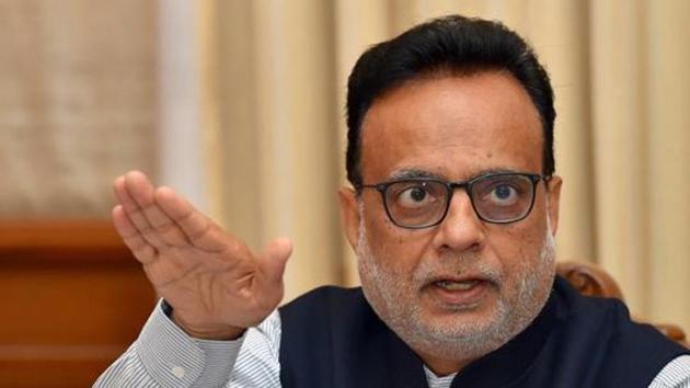 Revenue Secretary Hasmukh Adhia gestures as he addresses a news conference in the finance ministry.(PTI Photo)