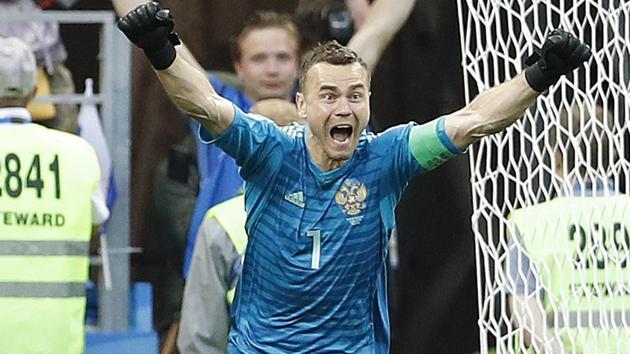 Russia goalkeeper Igor Akinfeev celebrates after he saved the last penalty shot by Spain's Iago Aspas. (AP)