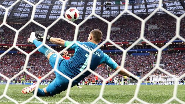 Russia's Igor Akinfeev saves Spain's Iago Aspas shot during the penalty shoot-out. (REUTERS)