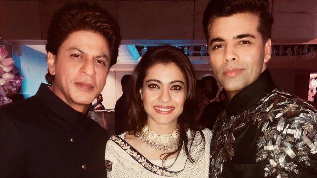 Karan Johar shared this picture with Kajol and Shah Rukh Khan from the engagement ceremony of Akash and Isha Ambani.(Instagram)