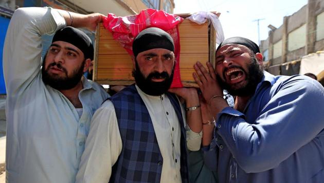 Afghan Sikh men carry the coffin of a victim of the suicide terror attack in Jalalabad city, Afghanistan, on July 2, 2018. (Reuters) Afghan Sikh men carry the coffin of a victim of the suicide terror attack in Jalalabad city, Afghanistan, on July 2, 2018. (Reuters)