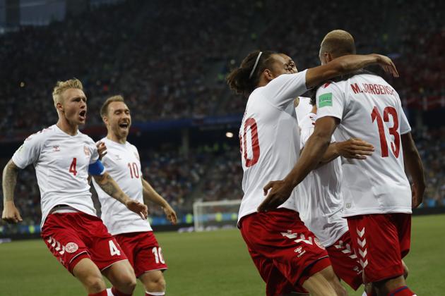 Denmark players celebrate after teammate Mathias Jorgensen, right, scored the opening goal. (AP) 