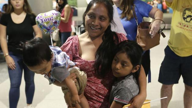 Buena Ventura Martin-Godinez, center, holds her son Pedro, left, as she is reunited with her daughter Janne, right, at Miami International Airport, Sunday, July 1, 2018, in Miami. (AP Photo) Buena Ventura Martin-Godinez, center, holds her son Pedro, left, as she is reunited with her daughter Janne, right, at Miami International Airport, Sunday, July 1, 2018, in Miami. (AP Photo)