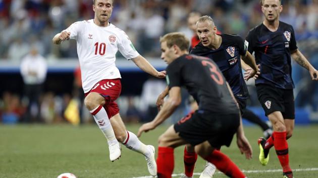 Denmark's Christian Eriksen, left, challenges during the round of 16 match between Croatia and Denmark at the 2018 soccer World Cup in the Nizhny Novgorod Stadium. (AP) 