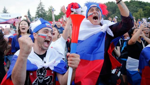 Russia fans celebrate react after the home team won the penalty shoot-out during the FIFA World Cup Round of 16 match against Spain in Moscow on Sunday.(AFP)