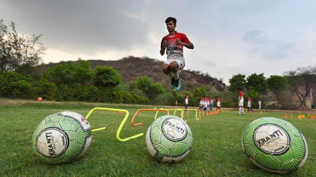 In 2016, impressed by the village’s passion for football, the Delhi United football club decided to train Ghamroj’s footballers and plans to make it ‘a model football village’. “Their footballers have great talent. Our club wishes to set up a residential academy to help develop football in the area,” said Krishan Kumar Ekka, head coach, Delhi United Football Club’s football academy. (Raj K Raj / HT Photo) In 2016, impressed by the village’s passion for football, the Delhi United football club decided to train Ghamroj’s footballers and plans to make it ‘a model football village’. “Their footballers have great talent. Our club wishes to set up a residential academy to help develop football in the area,” said Krishan Kumar Ekka, head coach, Delhi United Football Club’s football academy. (Raj K Raj / HT Photo)