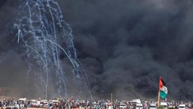 Tear gas canisters are fired by Israeli troops at Palestinian demonstrators during a protest marking al-Quds Day, (Jerusalem Day), at the Israel-Gaza border east of Gaza City June 8, 2018. (REUTERS File Photo)