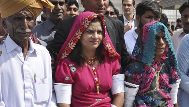 Krishna Kumari, center, newly elected senator of the Pakistani Hindu Community, arrives at the Parliament with her family members in Islamabad, Pakistan, Monday, March 12, 2018.(AP File Photo)