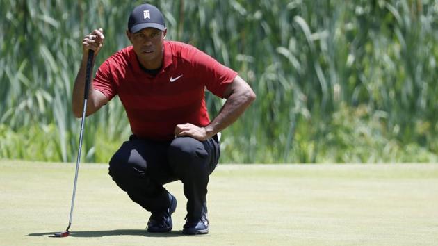 Tiger Woods of the United States lines up a birdie putt on the third hole during the final round of The National golf tournament at TPC Potomac at Avenel Farm.(USA TODAY Sports)