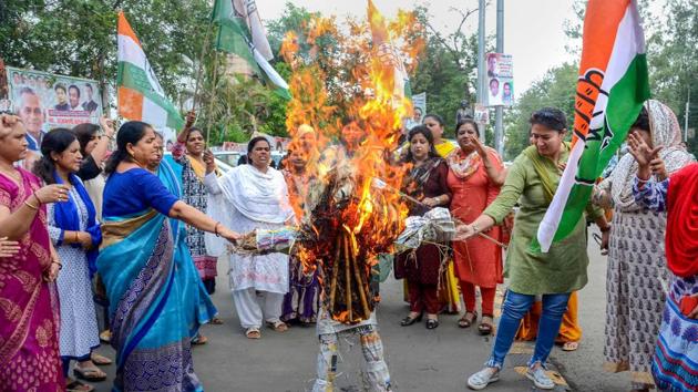 Madhya Pradesh Mahila Congress workers burn an effigy of chief minister Shivraj Singh Chouhan in protest against the rape of an eight-year-old girl who was abducted from outside her school in Mandsaur, on Friday. (PTI) Madhya Pradesh Mahila Congress workers burn an effigy of chief minister Shivraj Singh Chouhan in protest against the rape of an eight-year-old girl who was abducted from outside her school in Mandsaur, on Friday. (PTI)