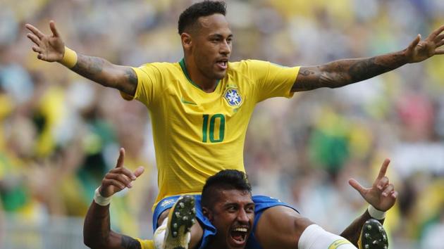 Brazil's Neymar, top, celebrates with team mate Paulinho after scoring his side's opening goal. (AP) Brazil's Neymar, top, celebrates with team mate Paulinho after scoring his side's opening goal. (AP)