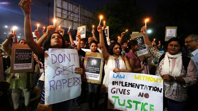 People hold candles and placards during a protest against the rape of an eight-year-old girl, in Kathua, near Jammu. (Reuters File Photo) People hold candles and placards during a protest against the rape of an eight-year-old girl, in Kathua, near Jammu. (Reuters File Photo)