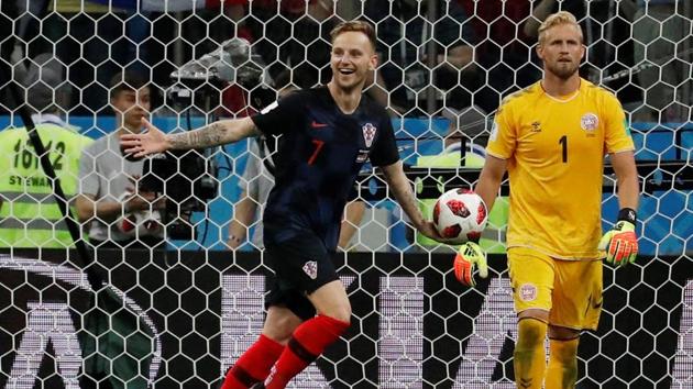 Croatia's Ivan Rakitic celebrates scoring the winning penalty during the shootout past Denmark's Kasper Schmeichel. (REUTERS) 