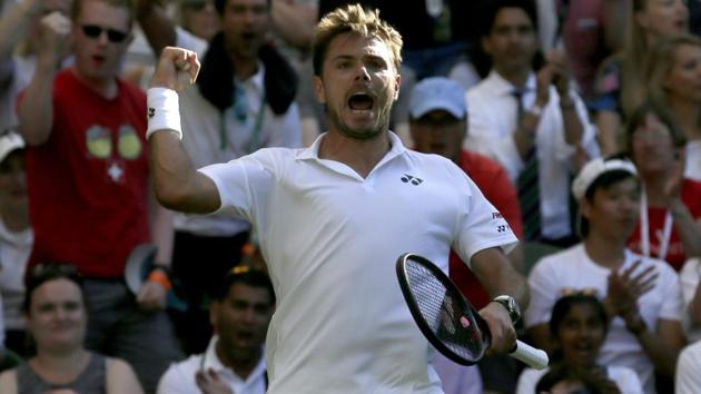 Stan Wawrinka celebrates after winning his match against Grigor Dimitrov at Wimbledon on Monday.(AP)