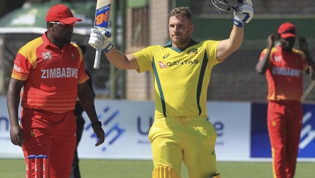 Australia batsman Aaron Finch celebrates scoring a century during the T20 match against Zimbabwe at Harare Sports Club on Tuesday.(AP)